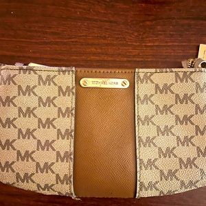 A Michael Kors Fanny pack or a waiste wallet or a small purse/wallet.